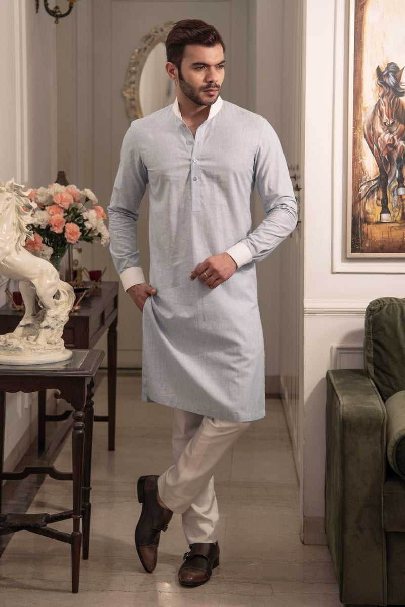 Greyish blue kurta with white collar and cuffs. Paired up with ivory pant cut pajama.