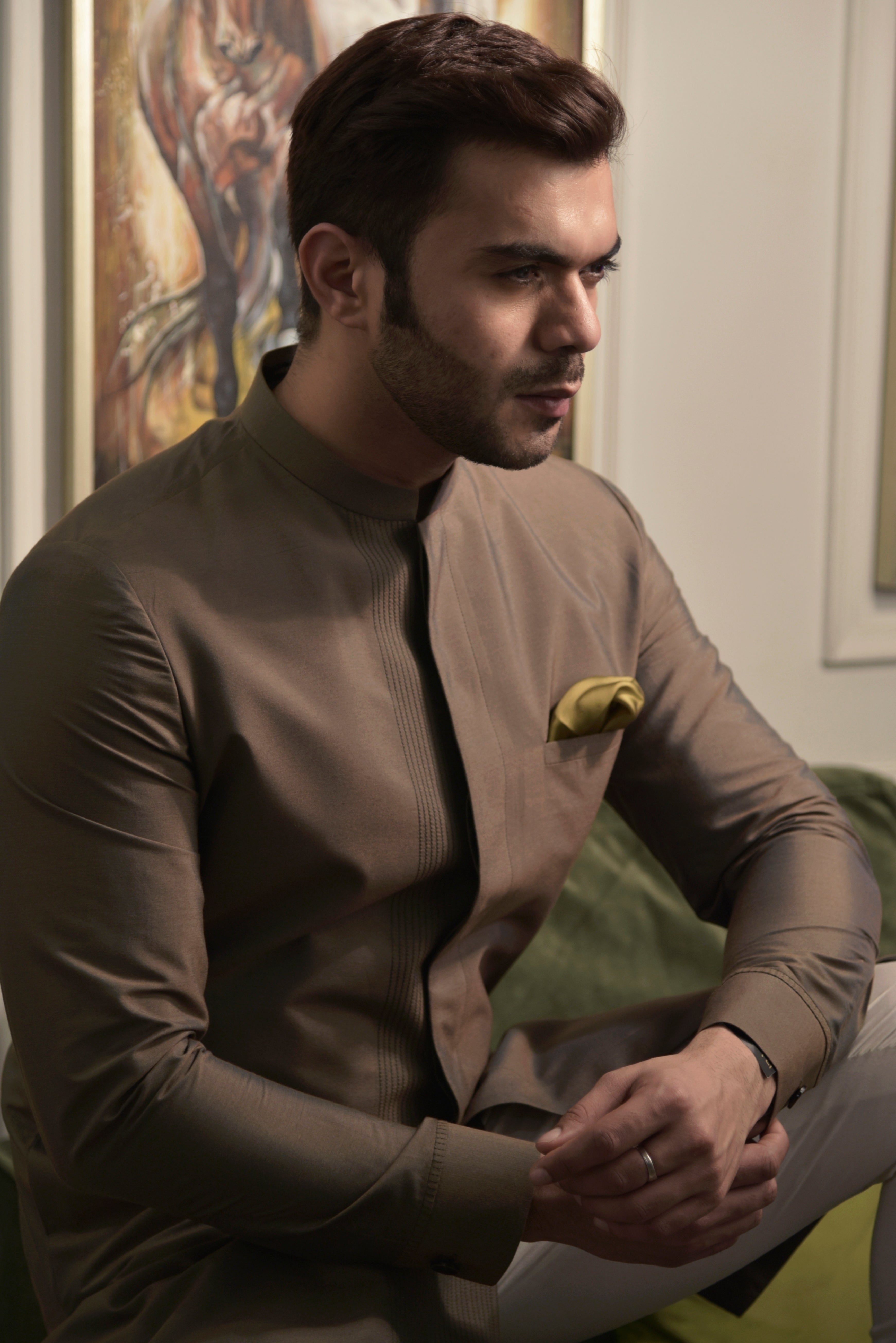 Brown sherwani cut kurta. Paired up with ivory pant cut pajama.