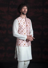 Pink nehru jacket with multicoloured embroidery with off white kurta pajama.