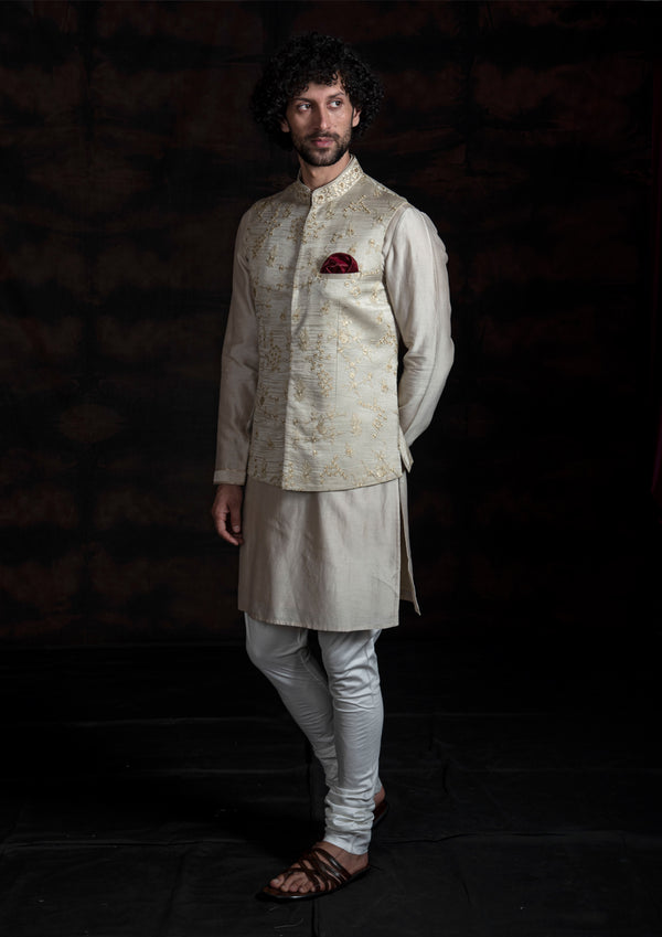 Light champagne nehru jacket with floral embroidery with silk kurta and pajama.