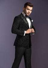 Black self tuxedo with peak lapel. Paired up with jet black pants.