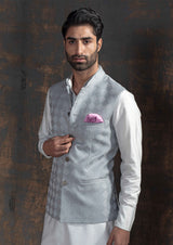 Grey embroidered nehru jacket with off white kurta pajama.