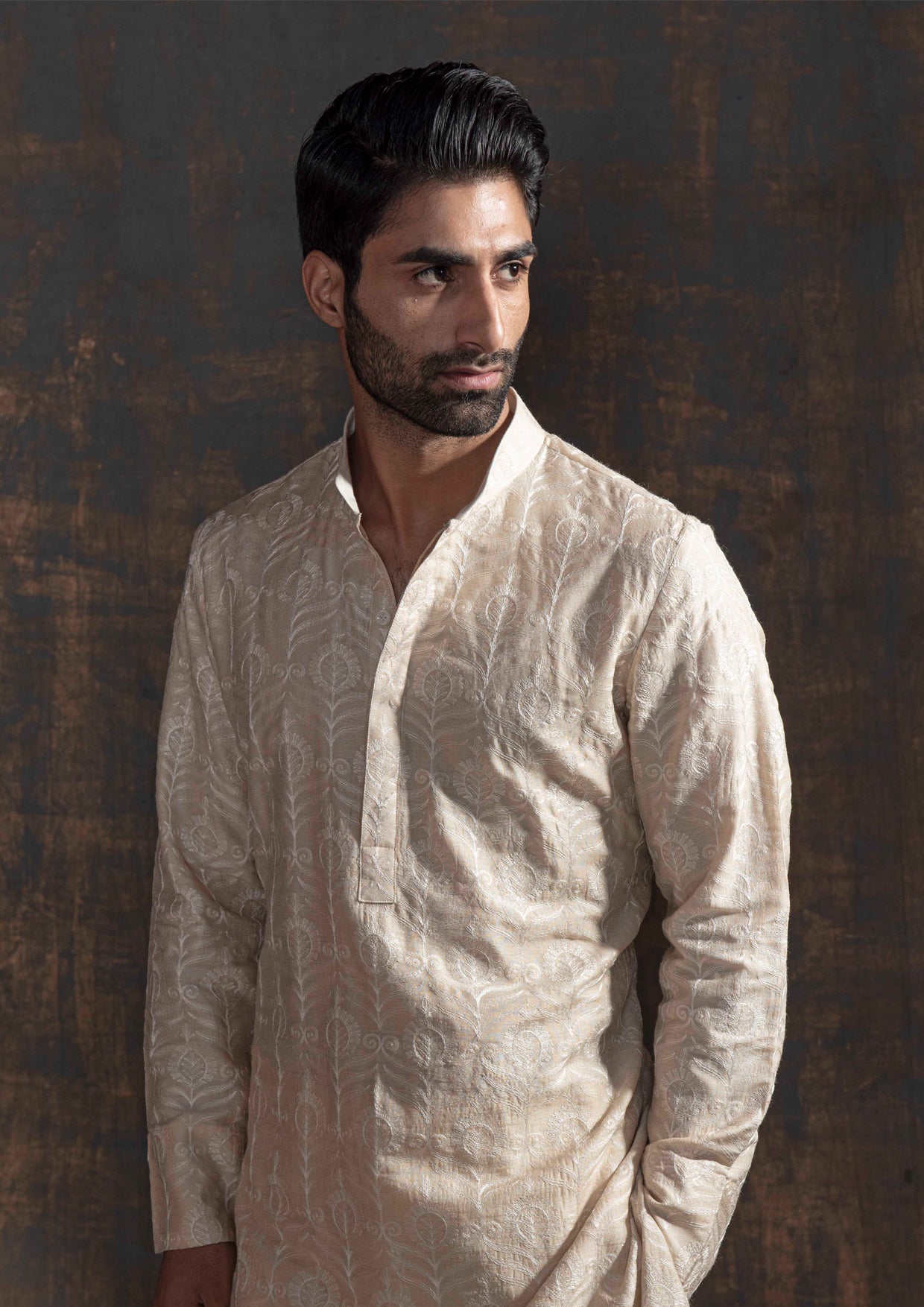 Beige kurta with ivory embroidery. Paired up with ivory pant pajama.