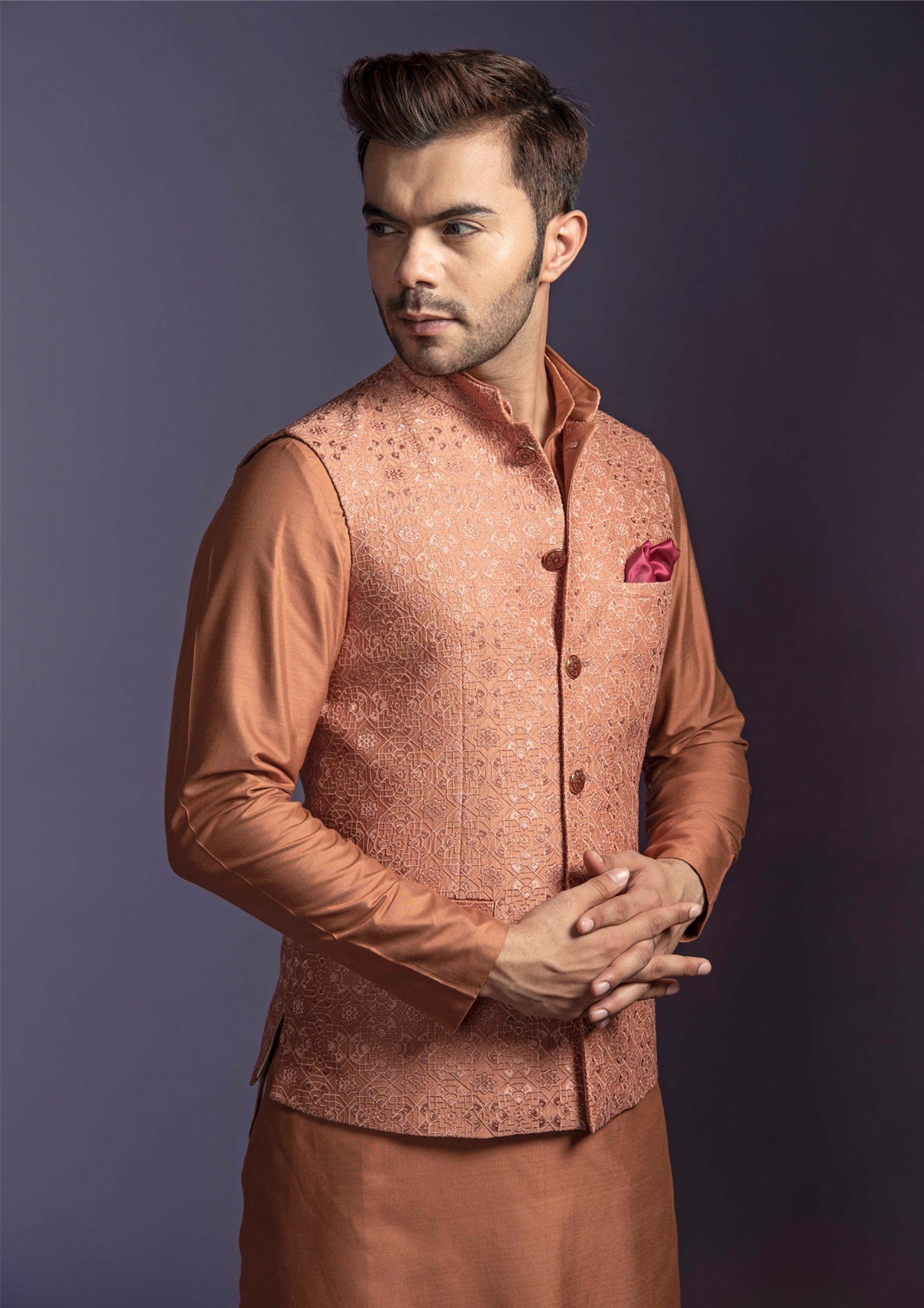 Rust shade nehru jacket and kurta with off white pant pajama.