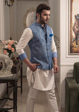 Blue floral embroidered nehru jacket. Paired up with off white kurta and pajama.
