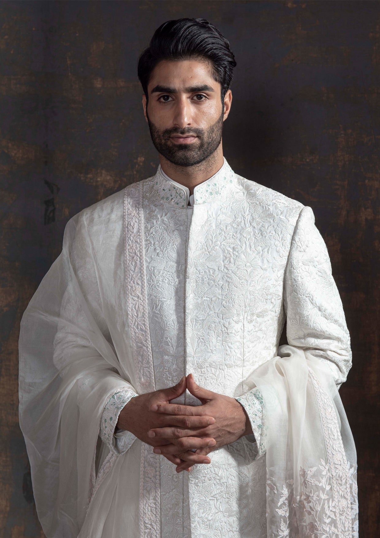 White self embroidered sherwani with off white kurta pajama.