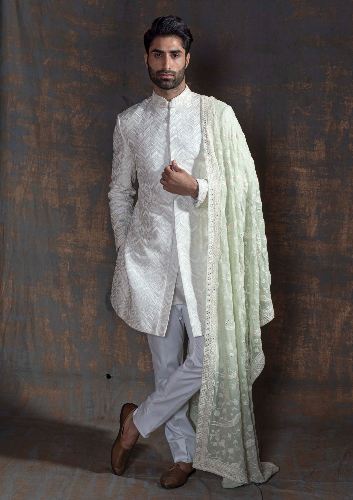 White self embroidered sherwani with off white kurta pajama.