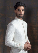 White self embroidered sherwani with off white kurta pajama.