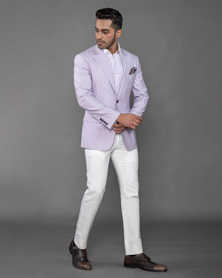 Lavender cotton blazer with peak lapel and jump stitch on the lapels.  Paired up with ivory pants.