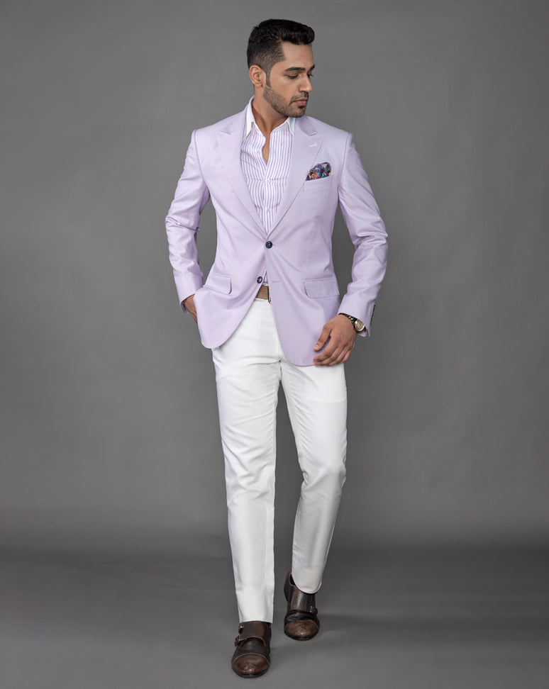 Lavender cotton blazer with peak lapel and jump stitch on the lapels.  Paired up with ivory pants.