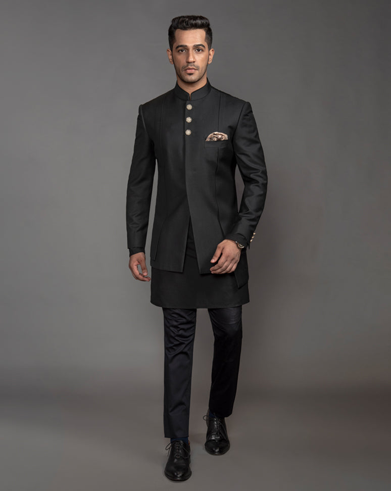 Black Asymmetrical Bandgala Jacket with textured buttons and drain work running alongside.  Paired up with black kurta pajama.