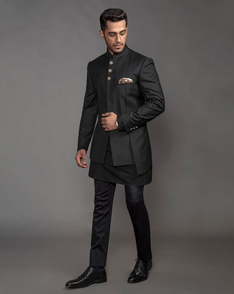 Black Asymmetrical Bandgala Jacket with textured buttons and drain work running alongside.  Paired up with black kurta pajama.