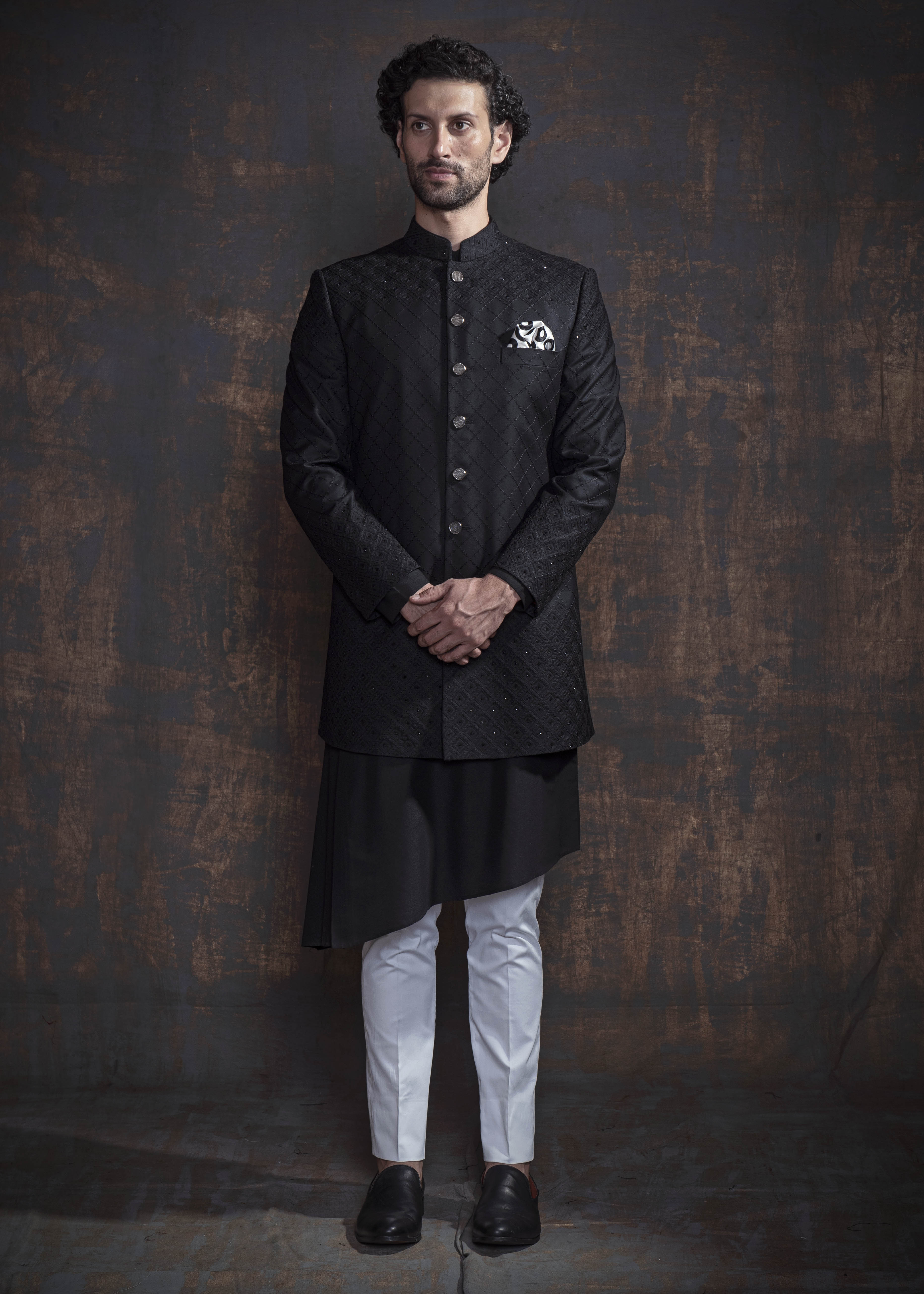 Black self embroidered indo western with black kurta and off white pajama.