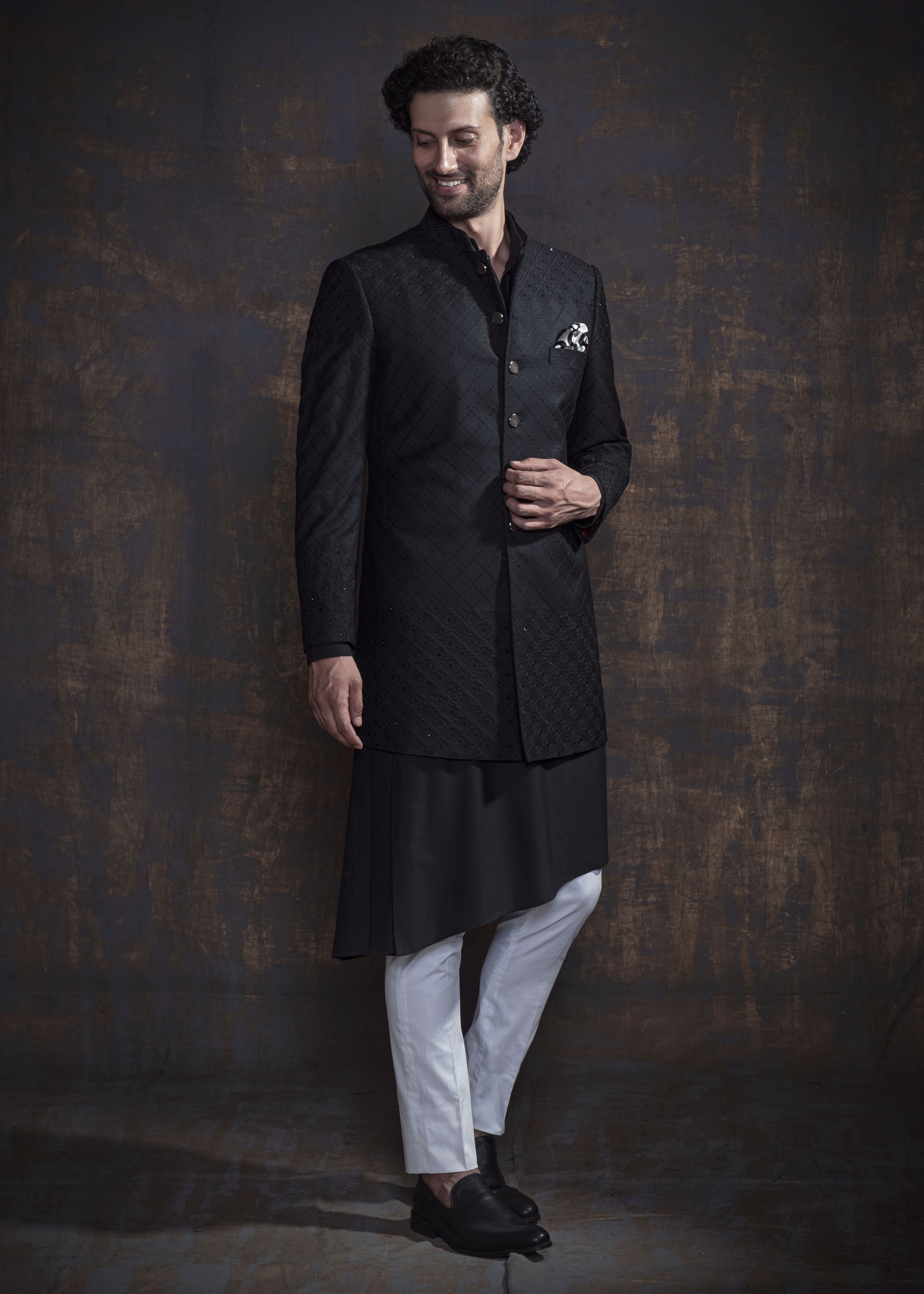 Black self embroidered indo western with black kurta and off white pajama.