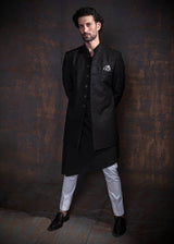 Black self embroidered indo western with black kurta and off white pajama.
