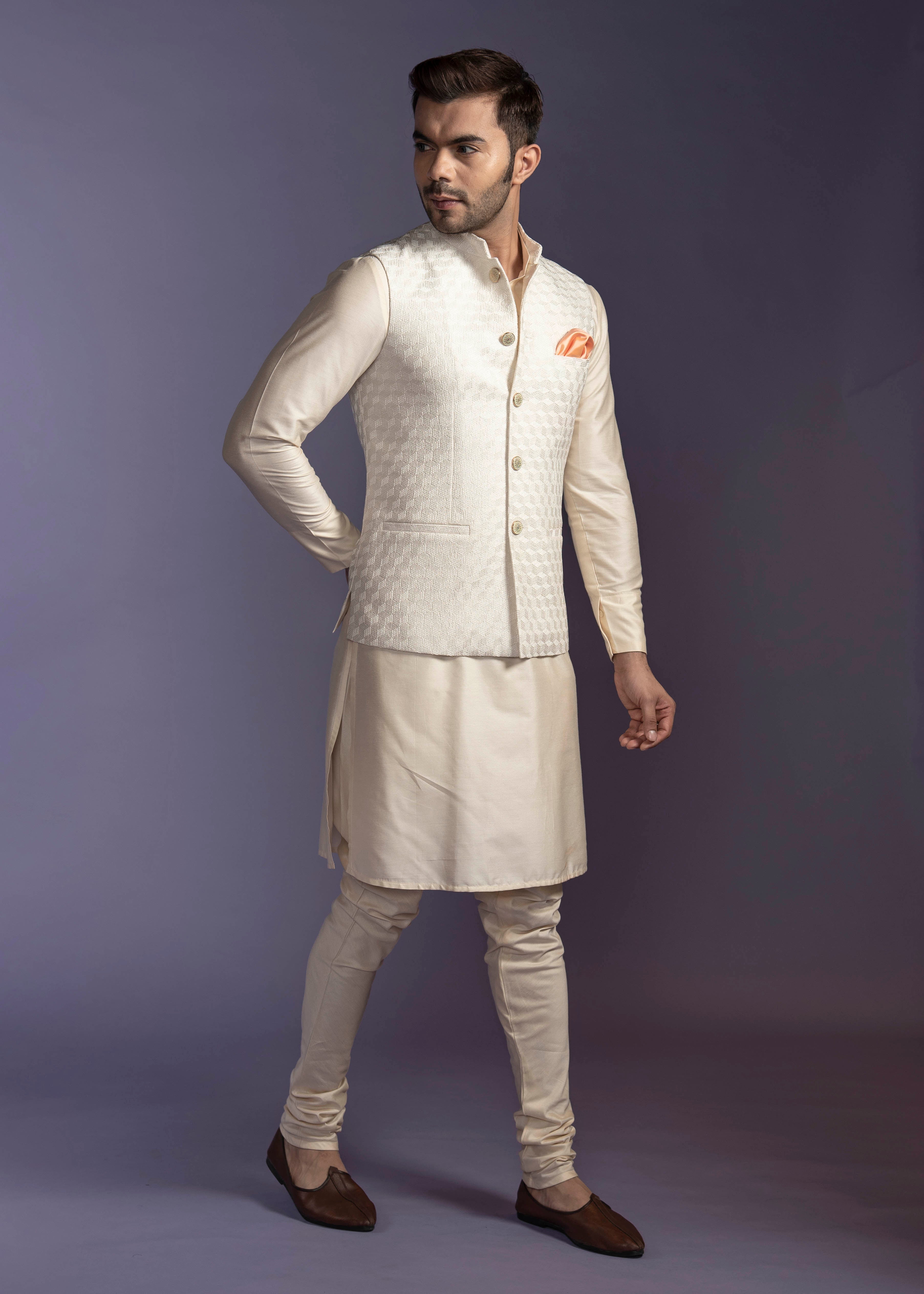 Champagne gold nehru jacket with champagne coloured kurta and chooridar.