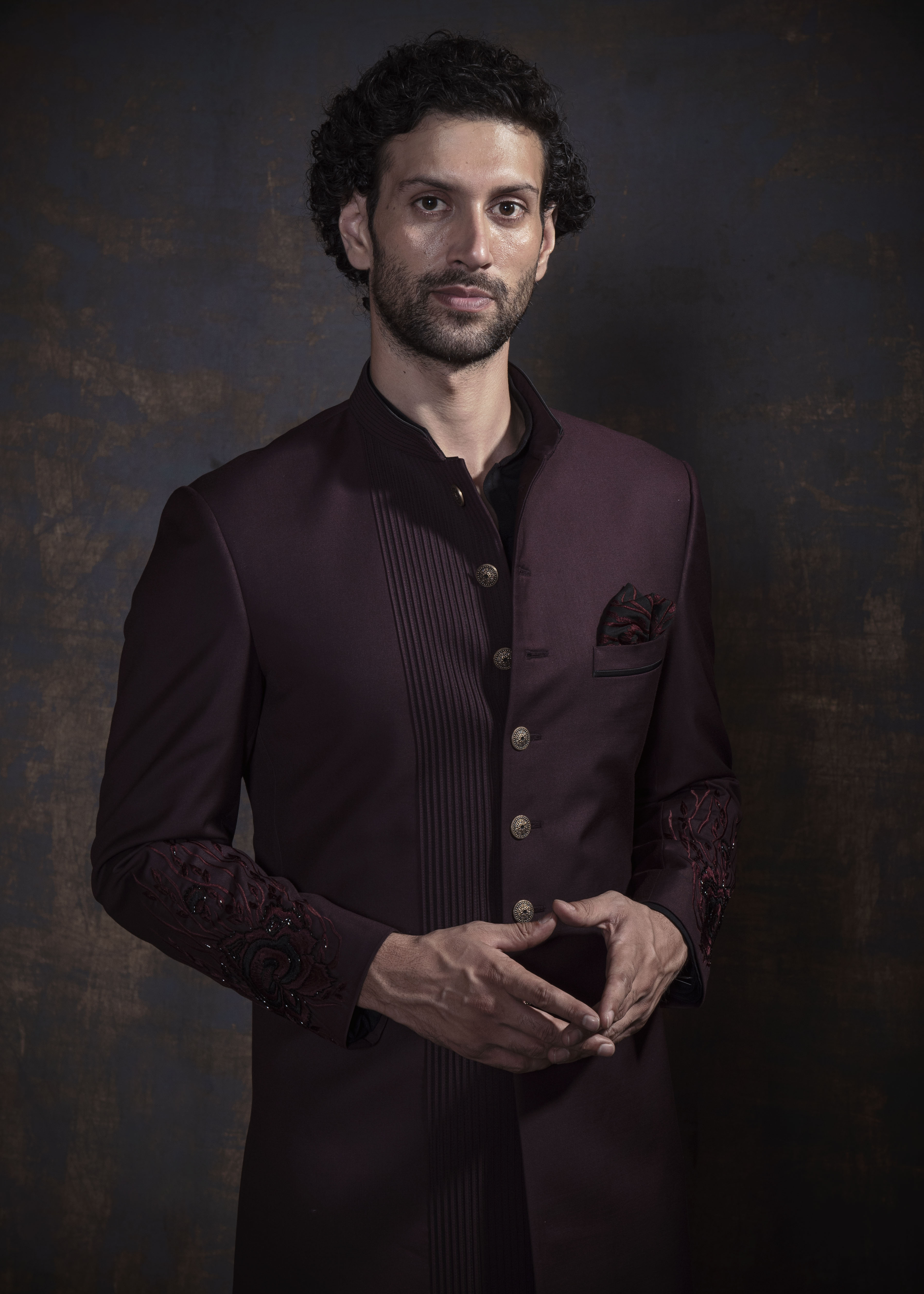 Wine embroidered indo western.  Paired up with black kurta and pajama.