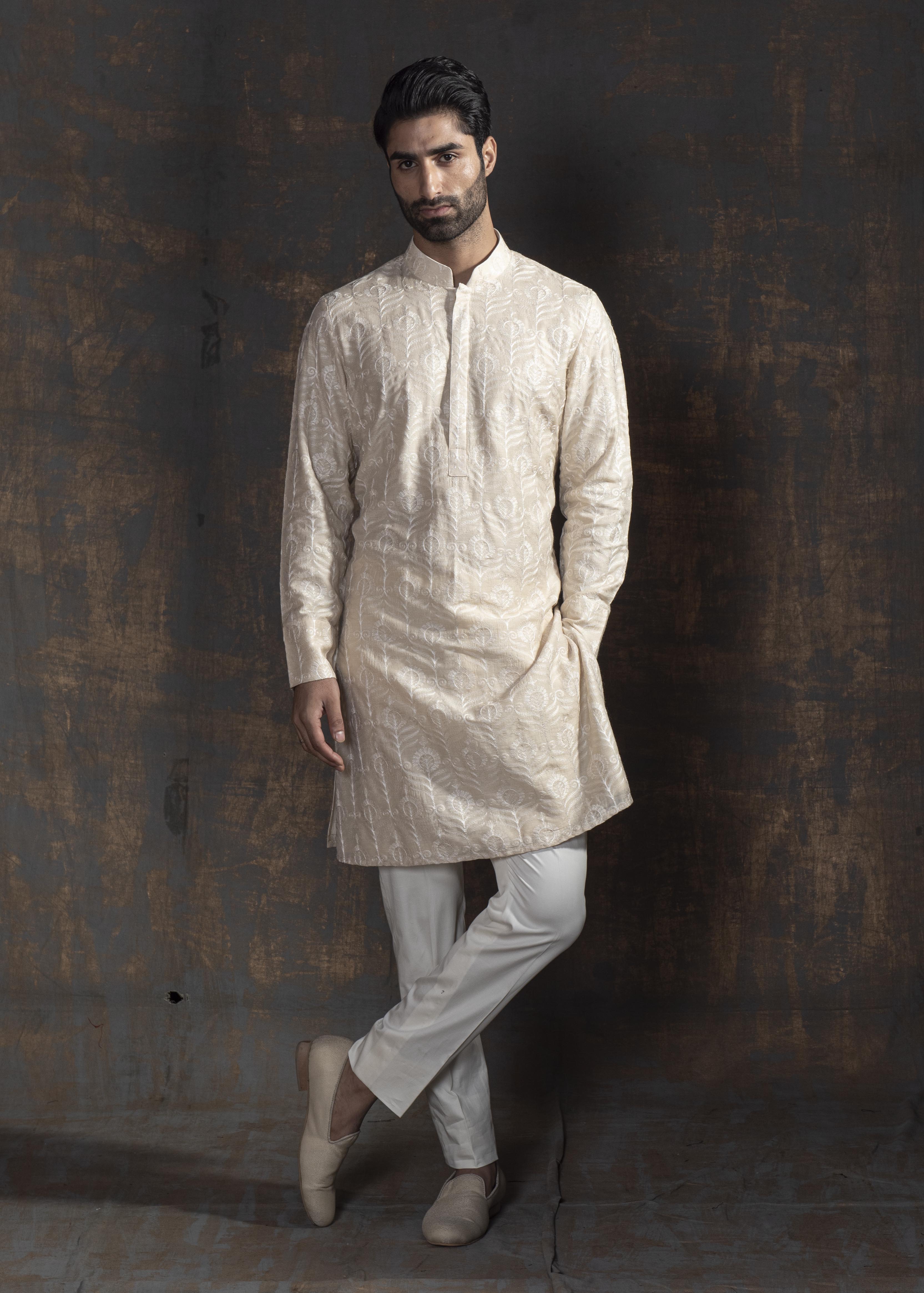 Beige kurta with ivory embroidery. Paired up with ivory pant pajama.