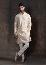 Beige kurta with ivory embroidery. Paired up with ivory pant pajama.