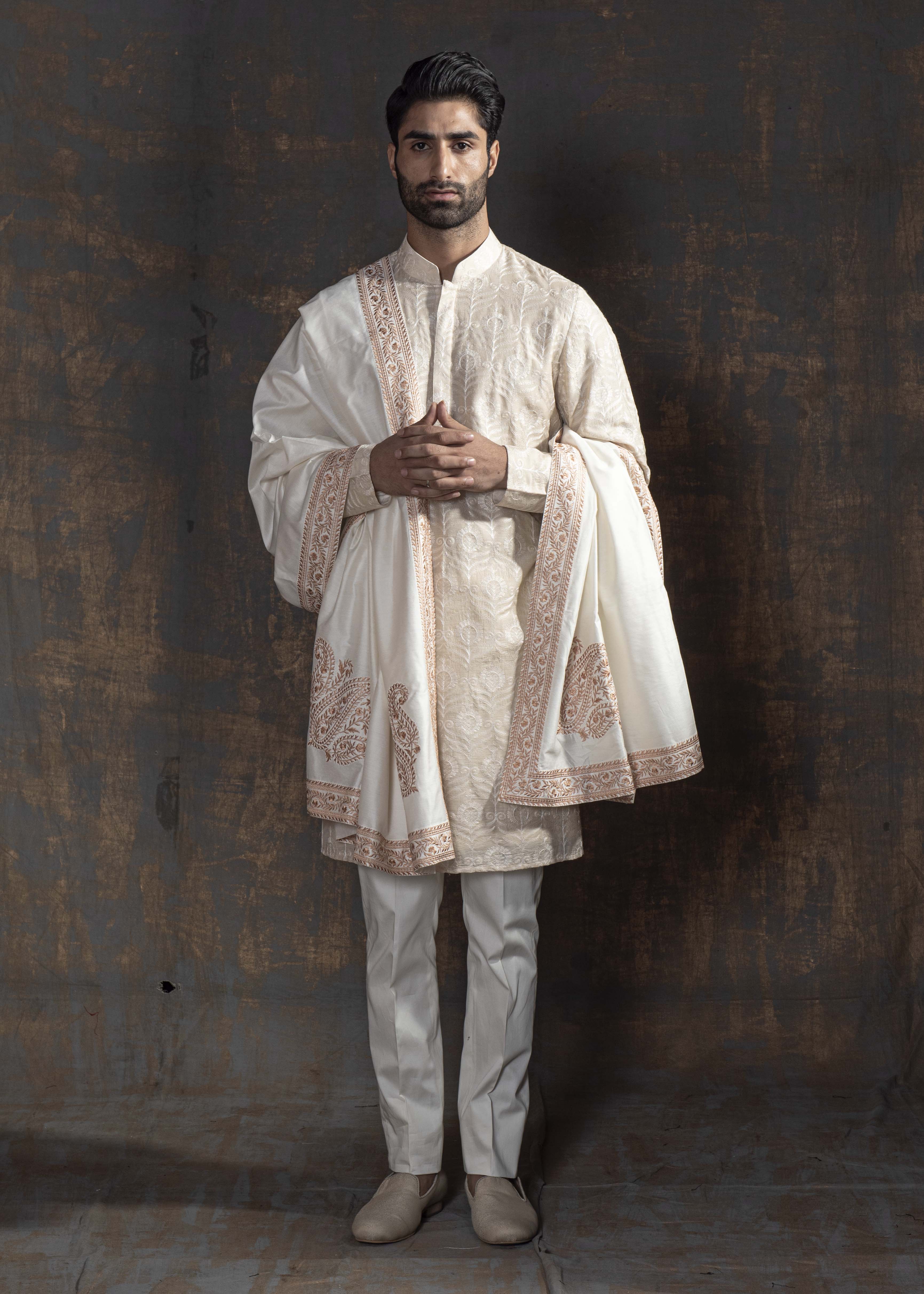 Beige kurta with ivory embroidery. Paired up with ivory pant pajama.