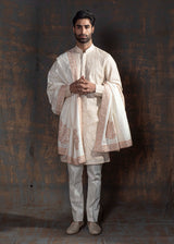 Beige kurta with ivory embroidery. Paired up with ivory pant pajama.
