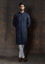 Blue embroidered kurta paired up with ivory pant pajama.