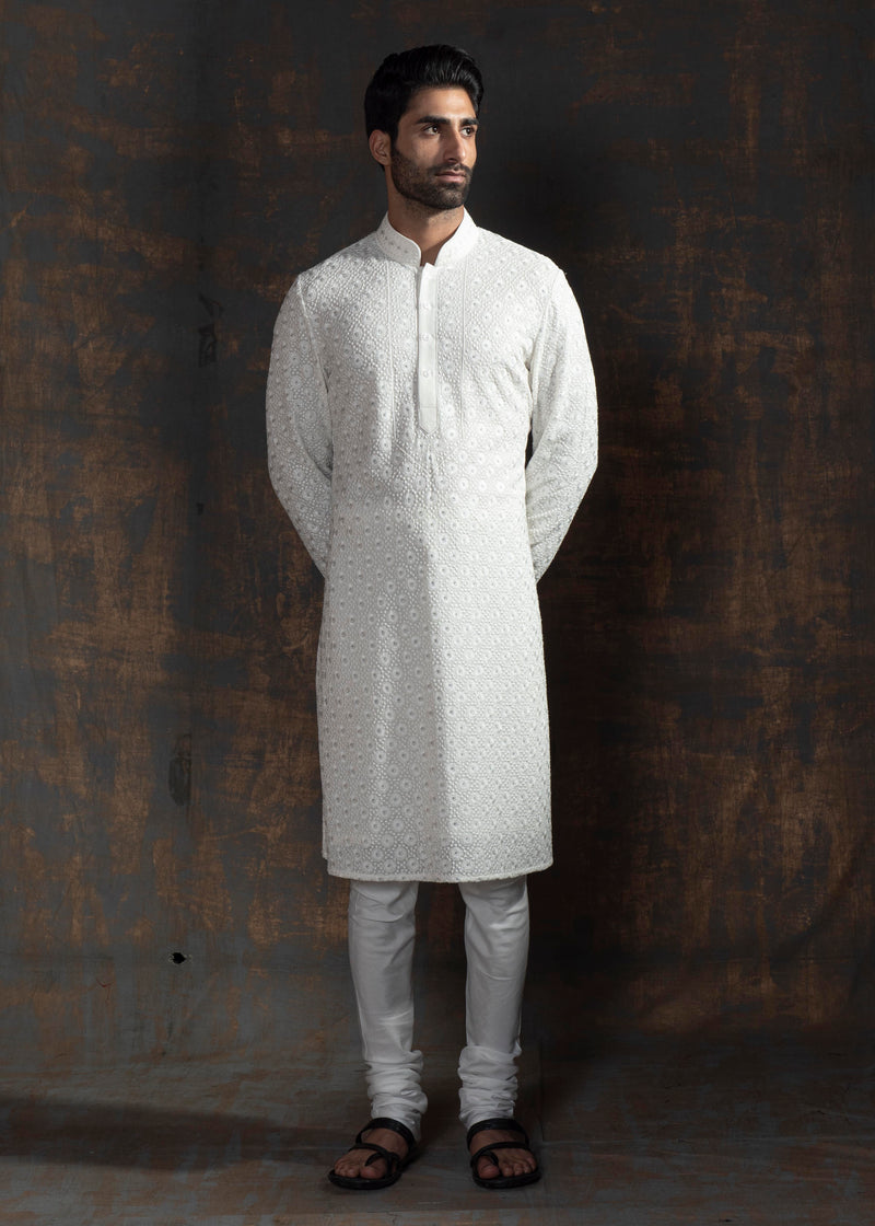 Ivory embroidered kurta paired up with ivory pant pajama.
