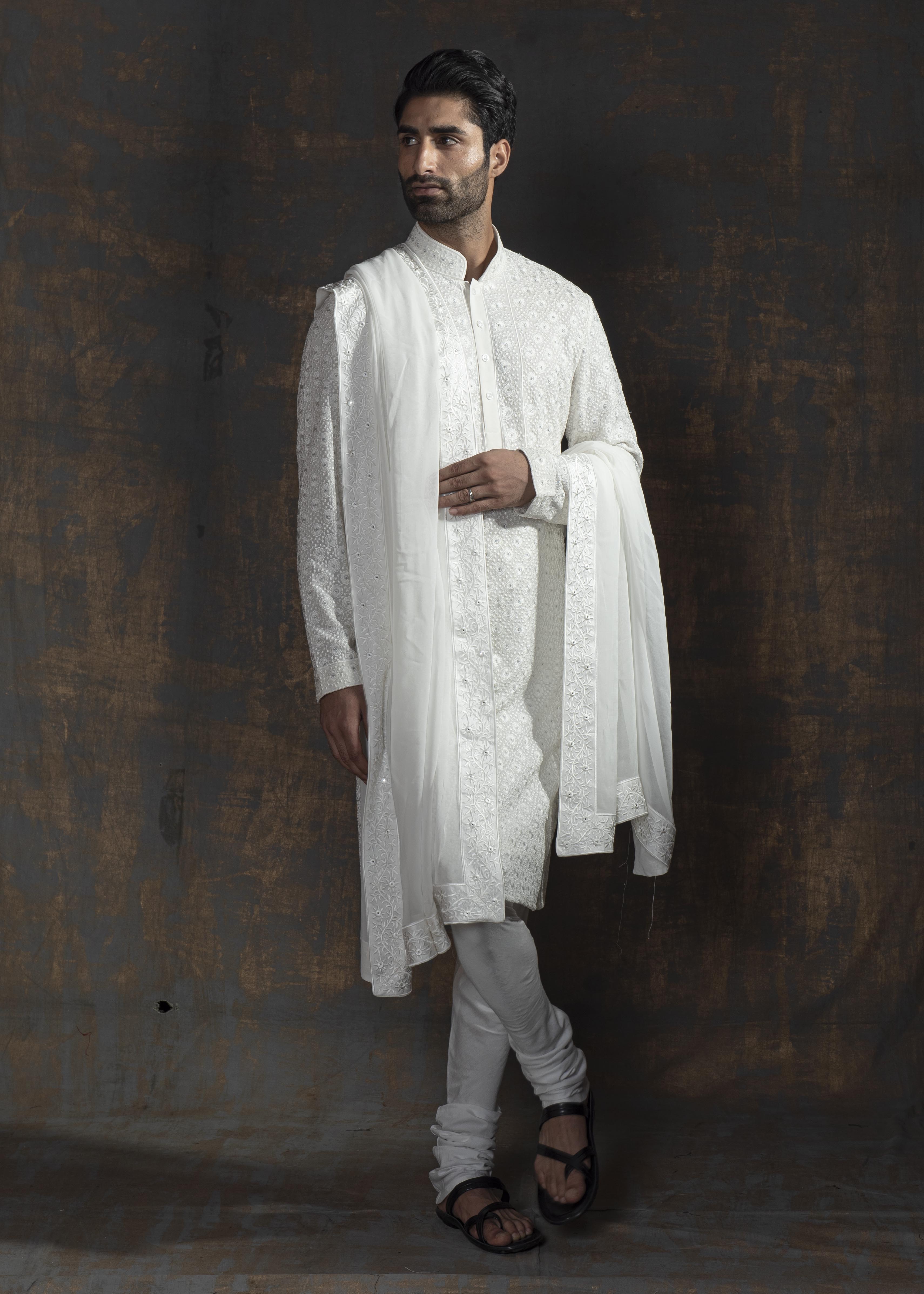 Ivory embroidered kurta paired up with ivory pant pajama.