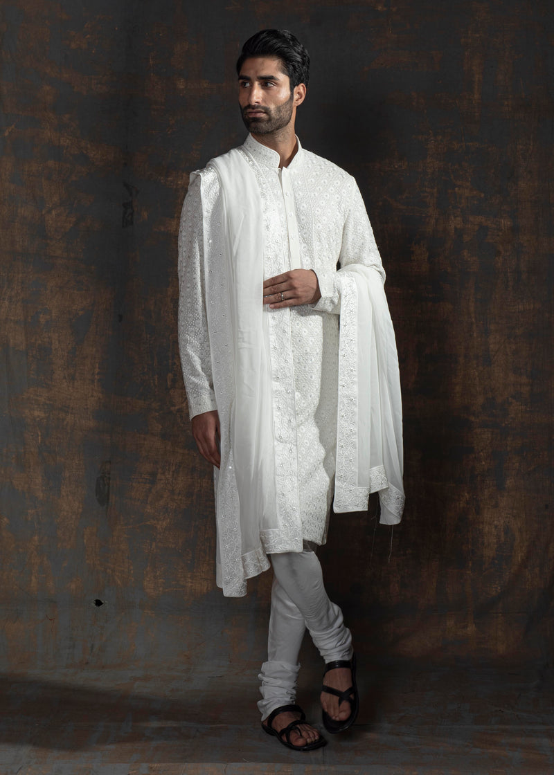 Ivory embroidered kurta paired up with ivory pant pajama.