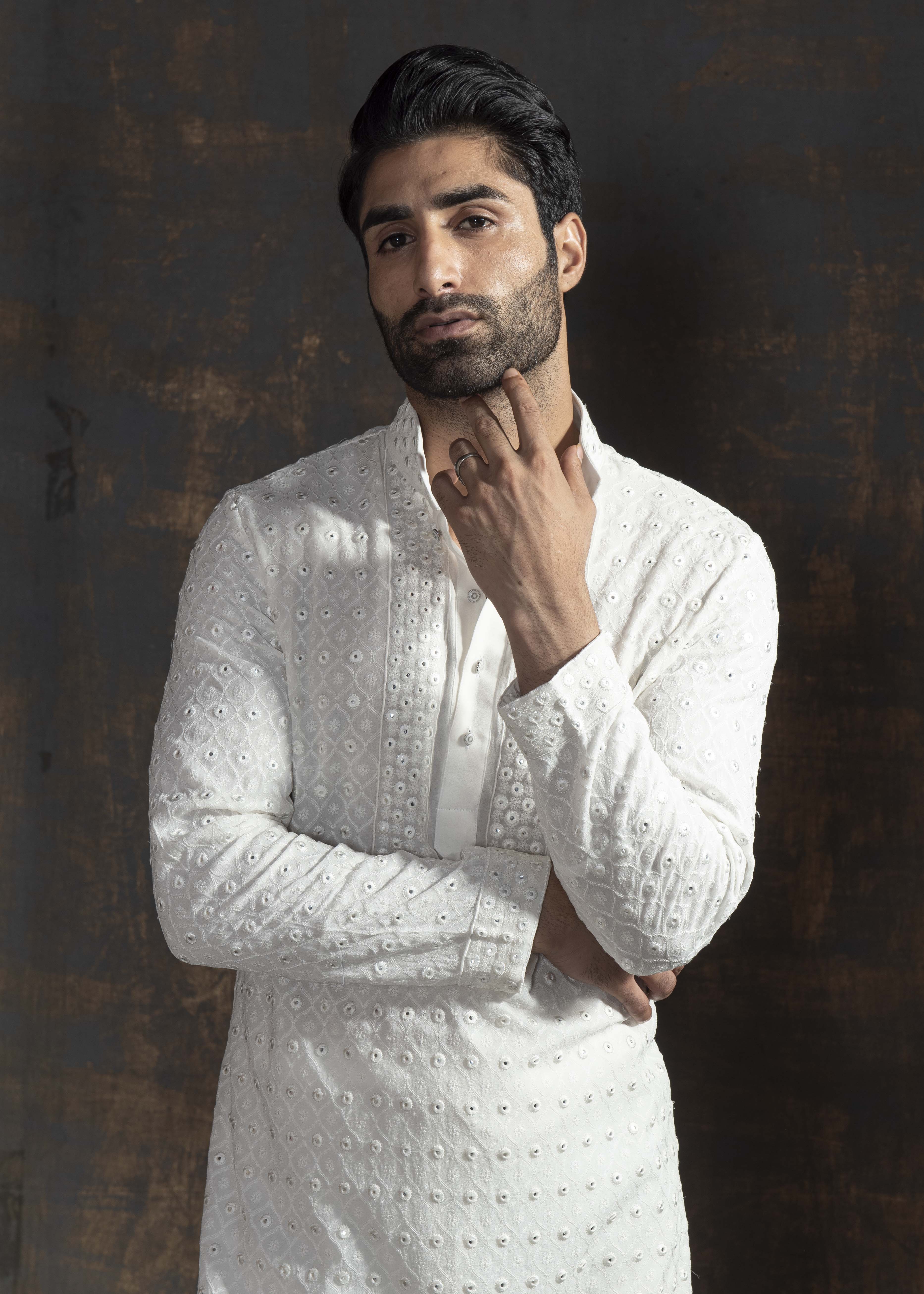 Ivory embroidered kurta paired up with ivory pant pajama.