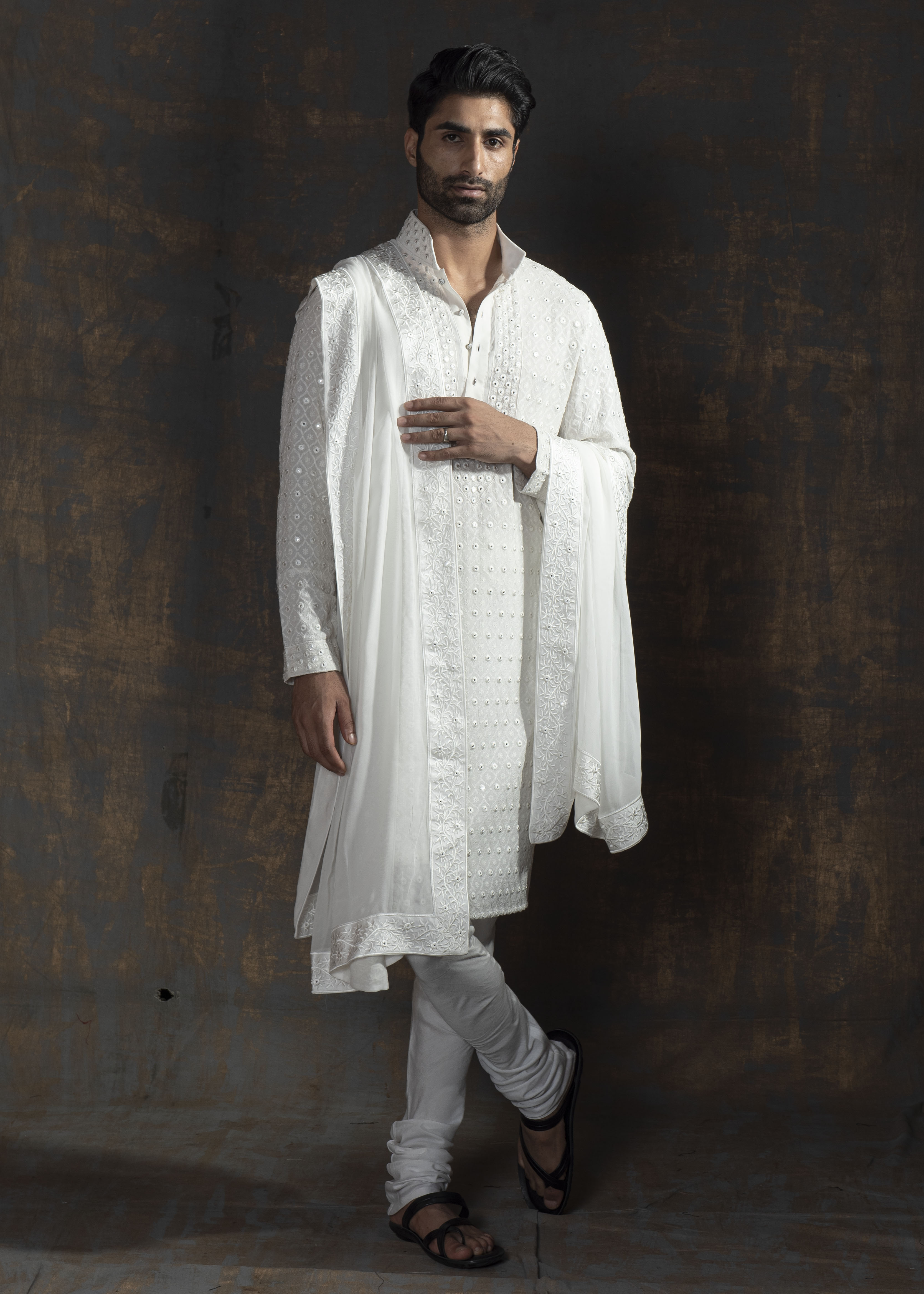 Ivory embroidered kurta paired up with ivory pant pajama.