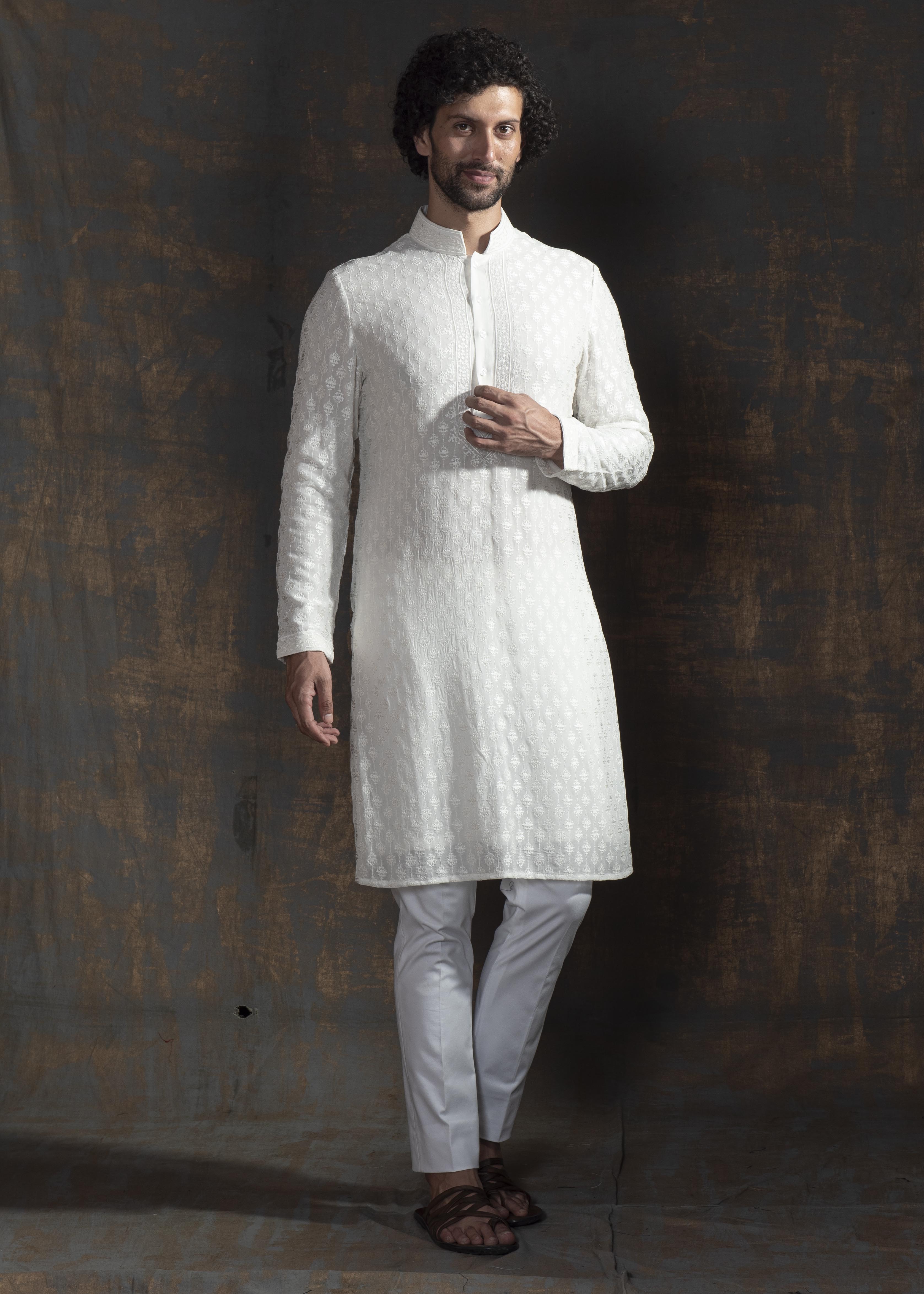 Ivory embroidered kurta paired up with ivory pant pajama.