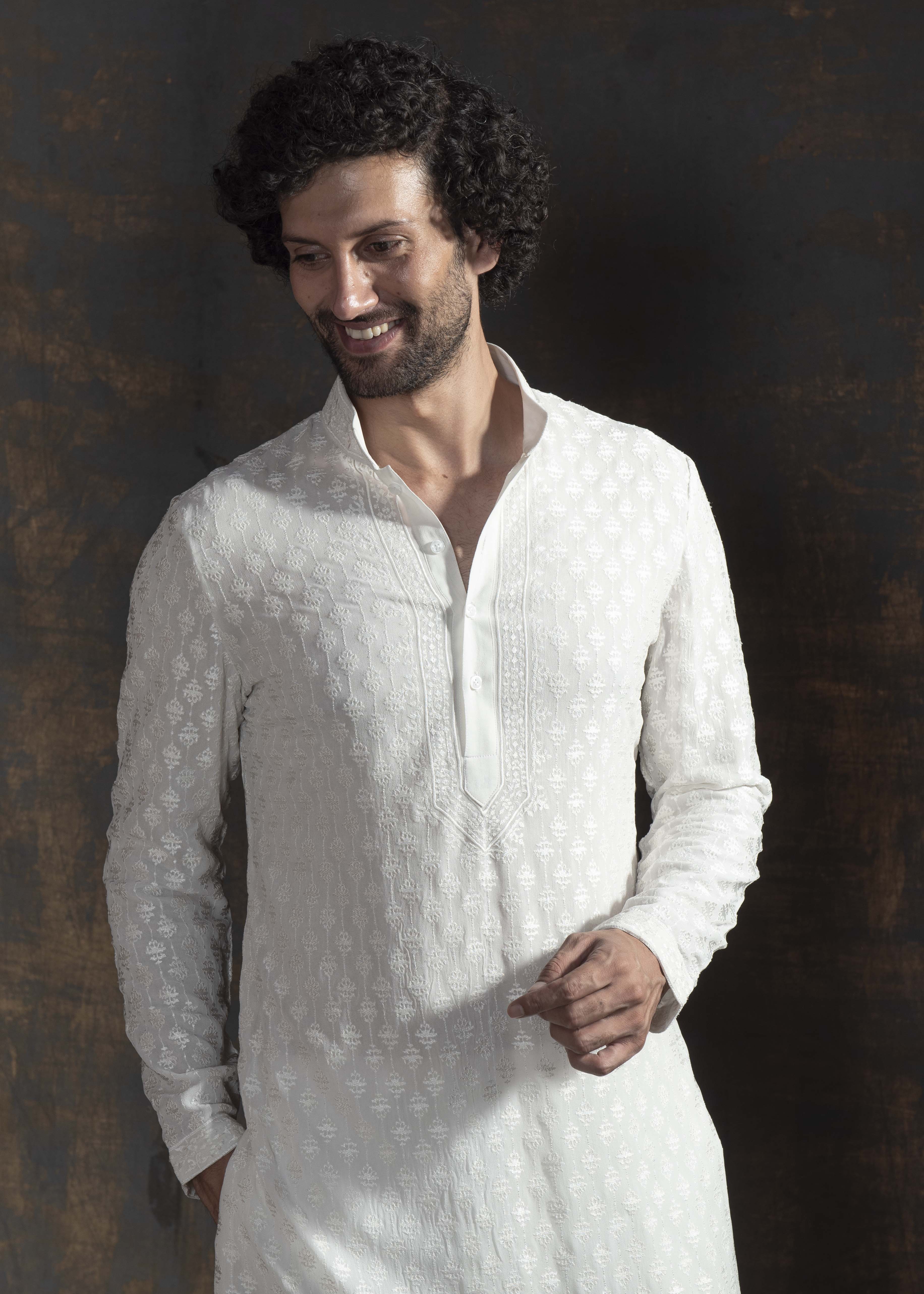 Ivory embroidered kurta paired up with ivory pant pajama.