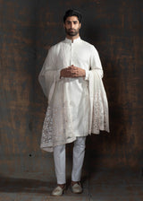 Ivory self printed kurta with ivory embroidery on the neck.  Paired up with ivory pant cut pajama.