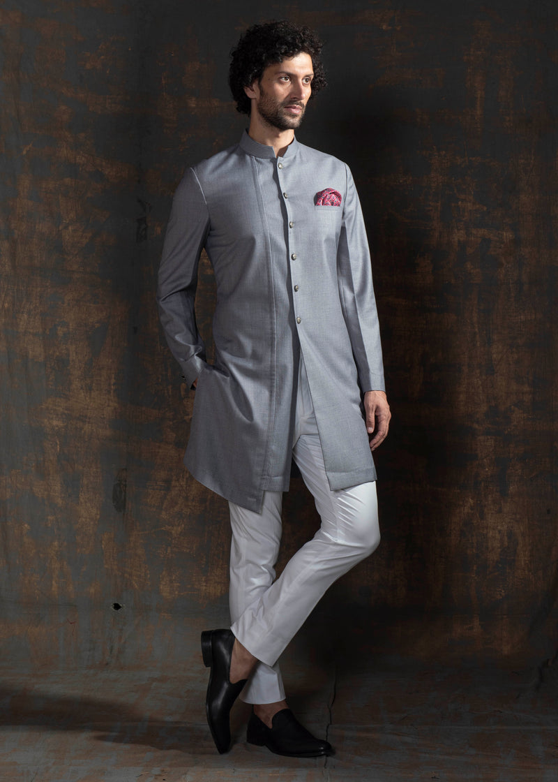 Grey sherwani cut kurta.  Paired up with ivory pant cut pajama.