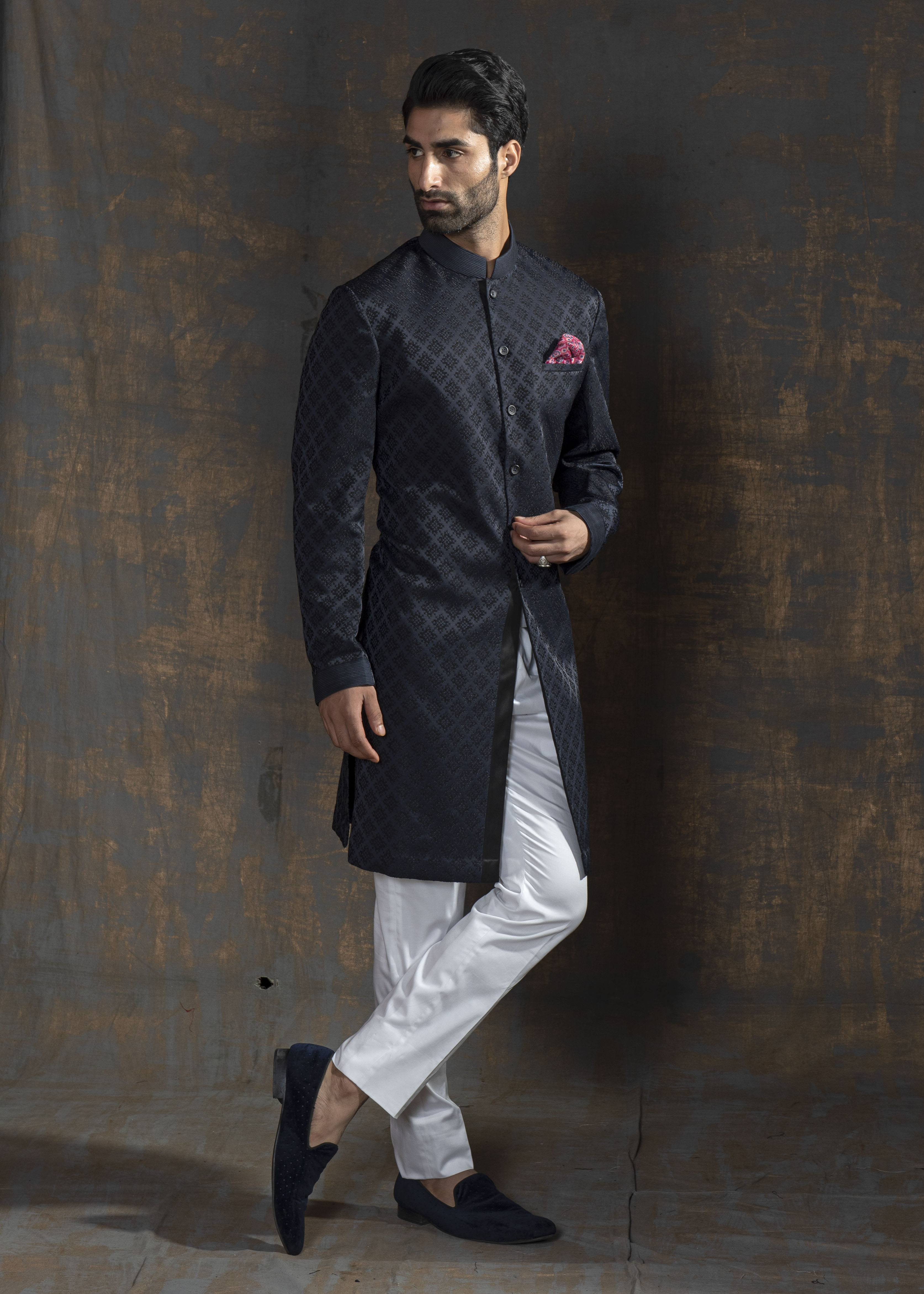 Blue self embroidered indo western with off white pants.