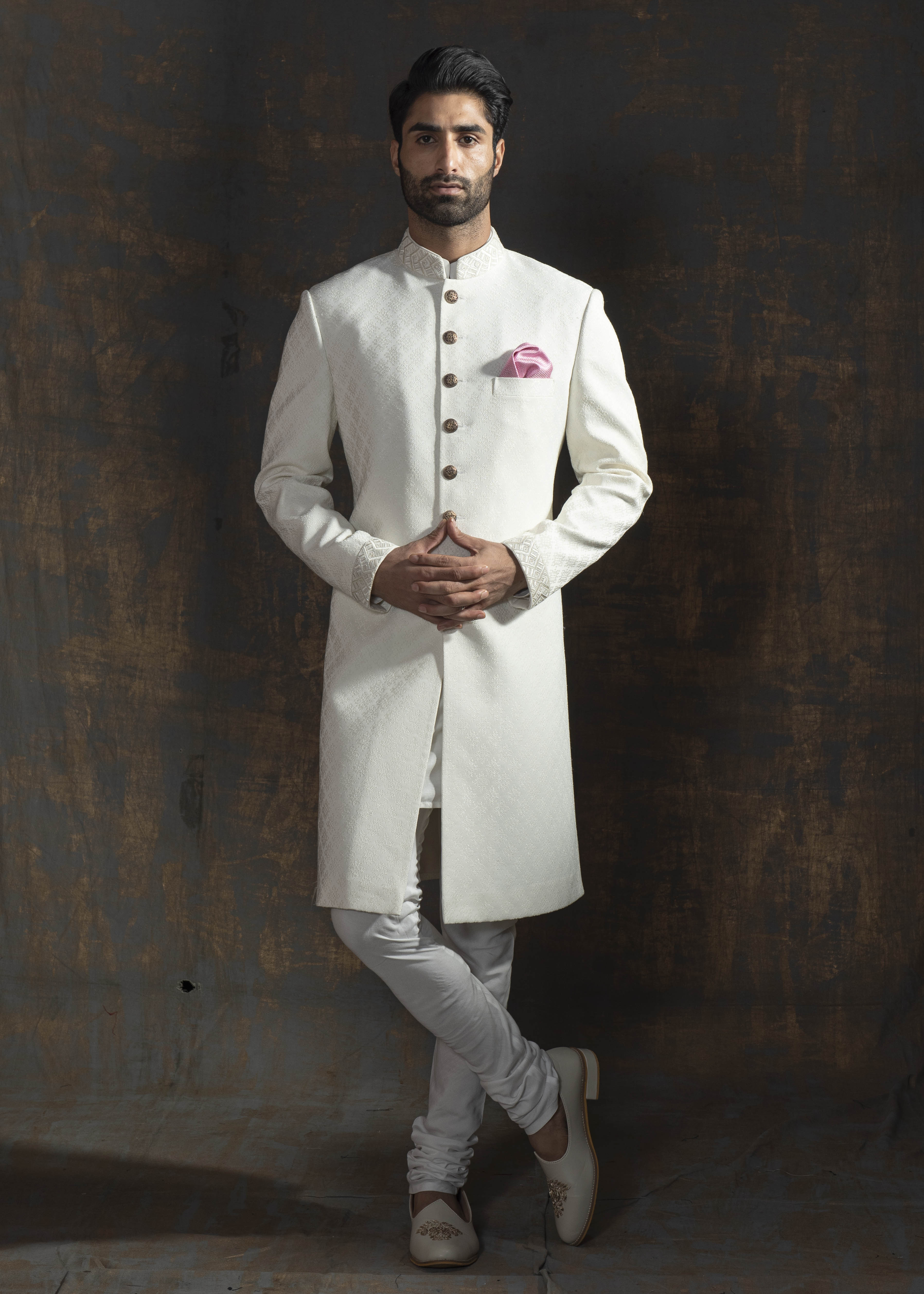 Ivory self embroidered indo western with off white pants.