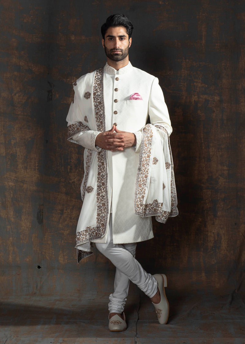 Ivory self embroidered indo western with off white pants.