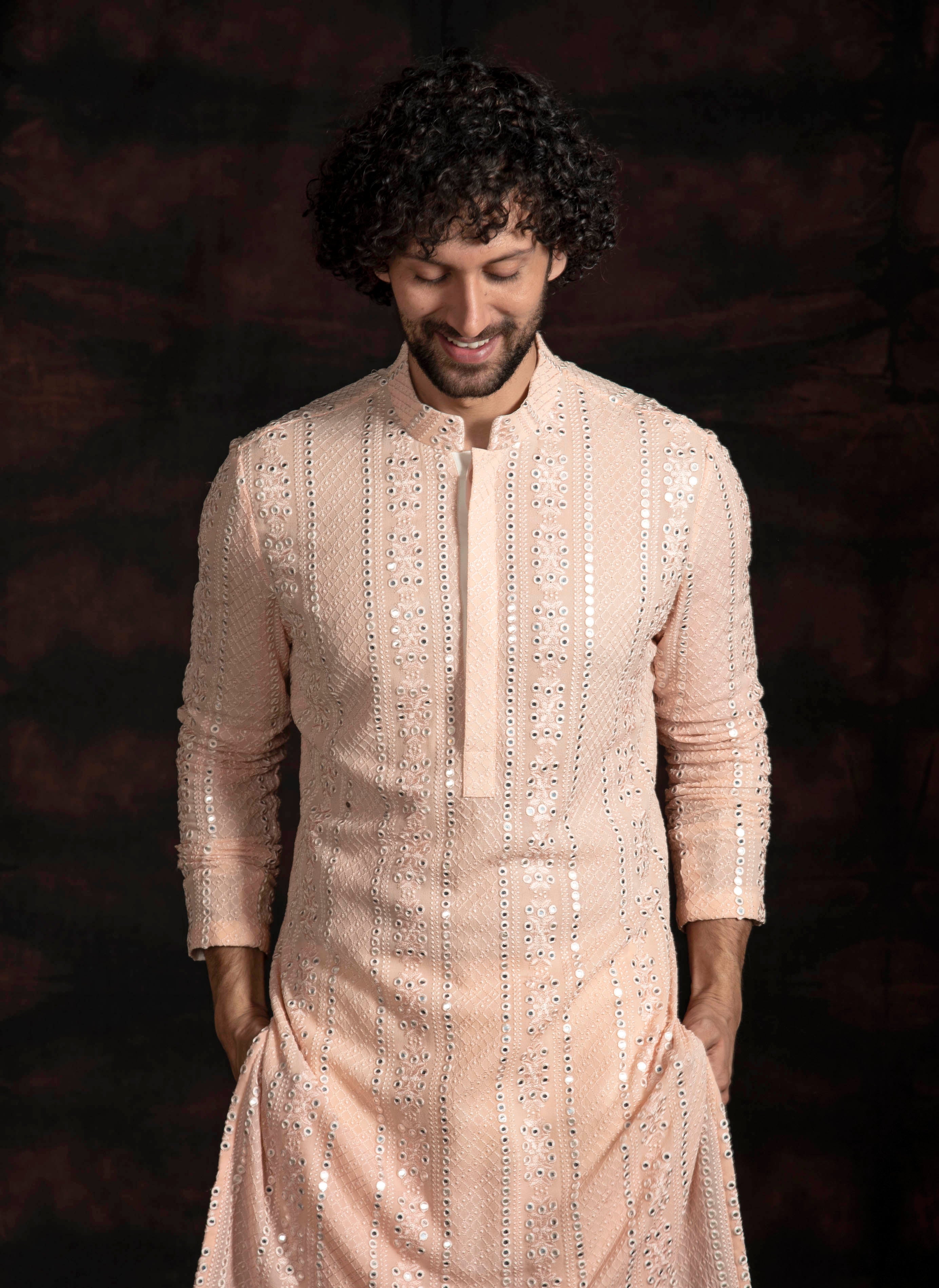 Peach mirror work kurta with ivory pant cut pajama.