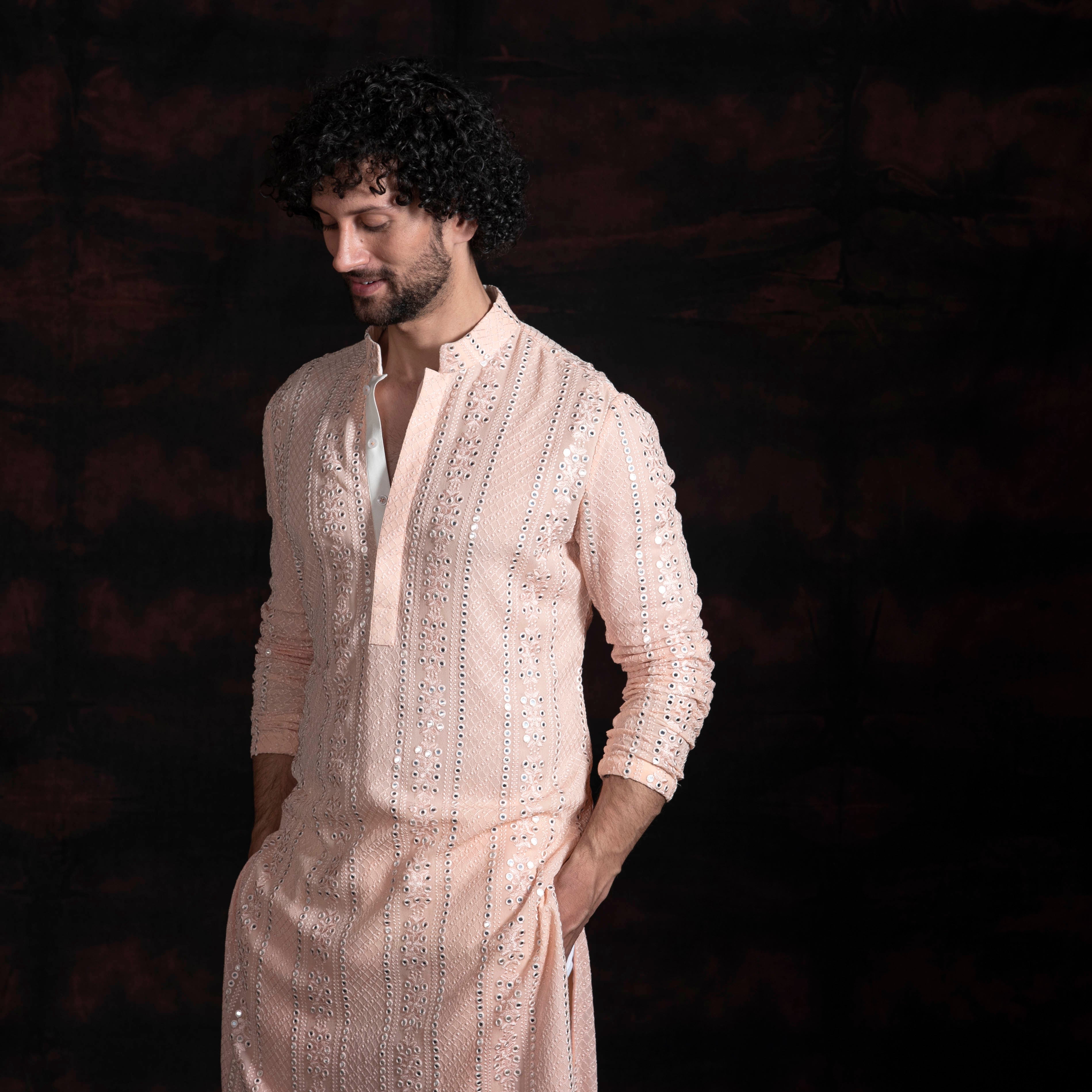 Peach mirror work kurta with ivory pant cut pajama.