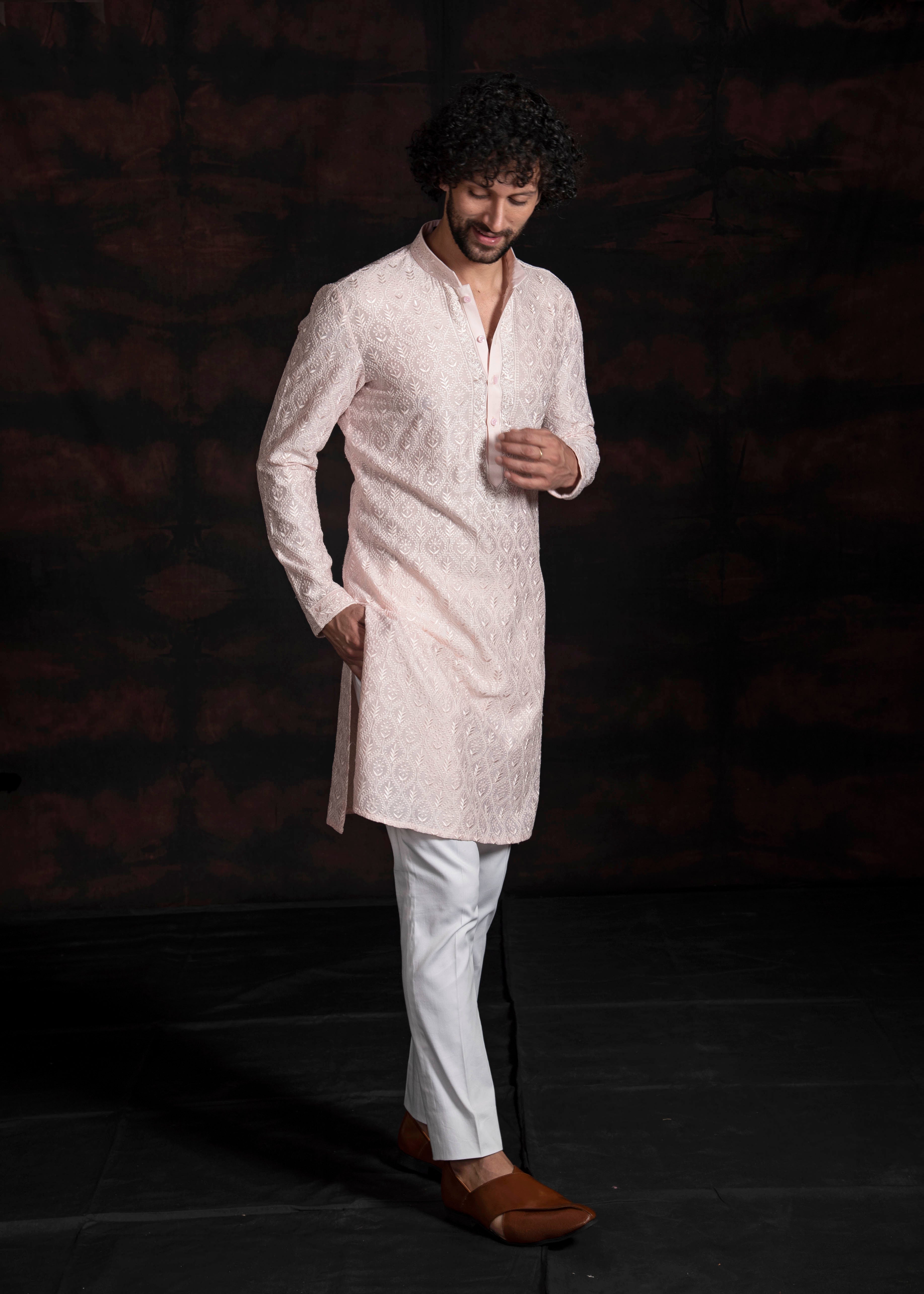 Powder pink embroidered kurta with ivory pants and powder pink embroidered stole.