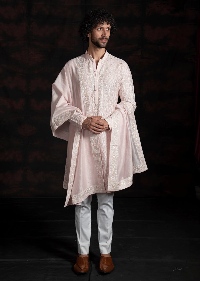 Powder pink embroidered kurta with ivory pants and powder pink embroidered stole.