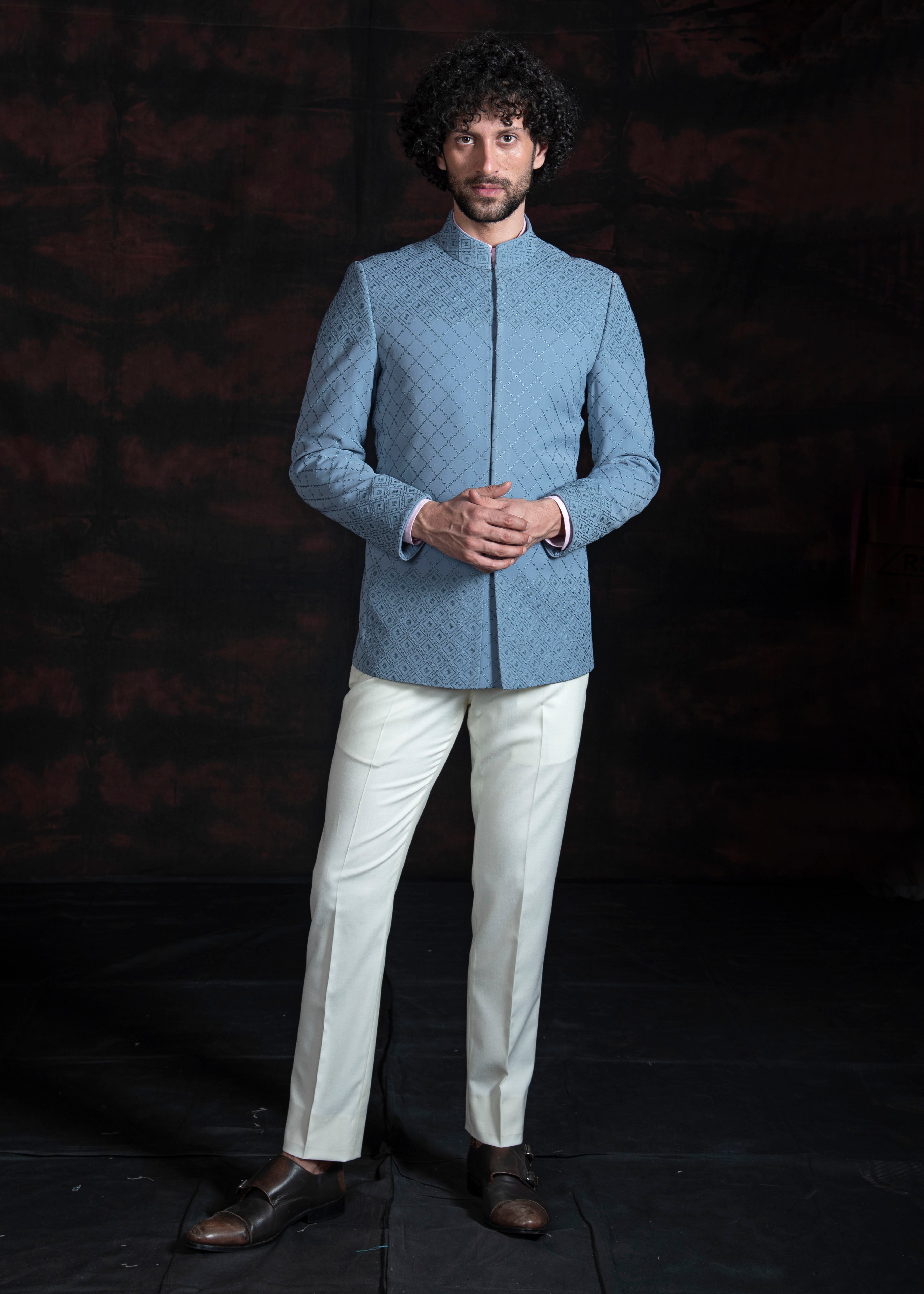 Light blue embroidered bandgala jacket with ivory pants.