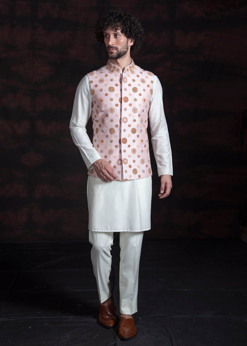 Pink nehru jacket with multicoloured embroidery with off white kurta pajama.