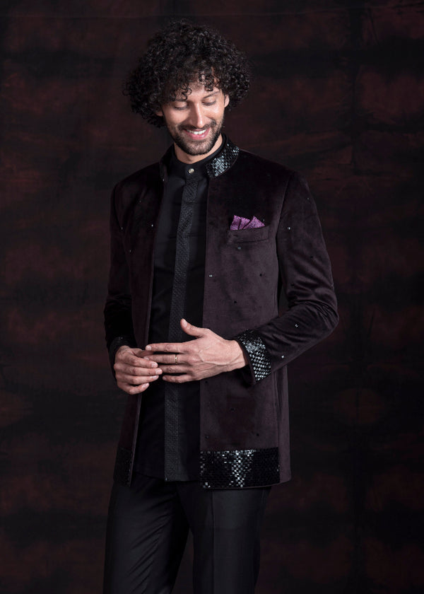 Wine coloured open bandgala jacket in velvet fabric with black hand embroidery on collar and cuffs.  Paired up with black embroidered shirt and pants. 