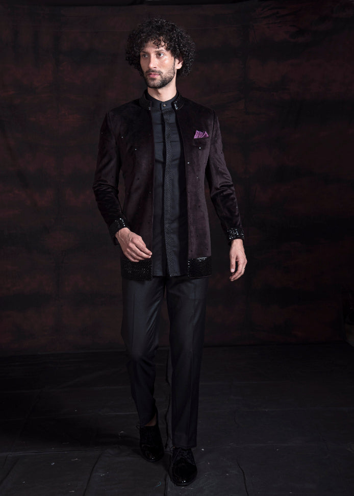 Wine coloured open bandgala jacket in velvet fabric with black hand embroidery on collar and cuffs.  Paired up with black embroidered shirt and pants. 