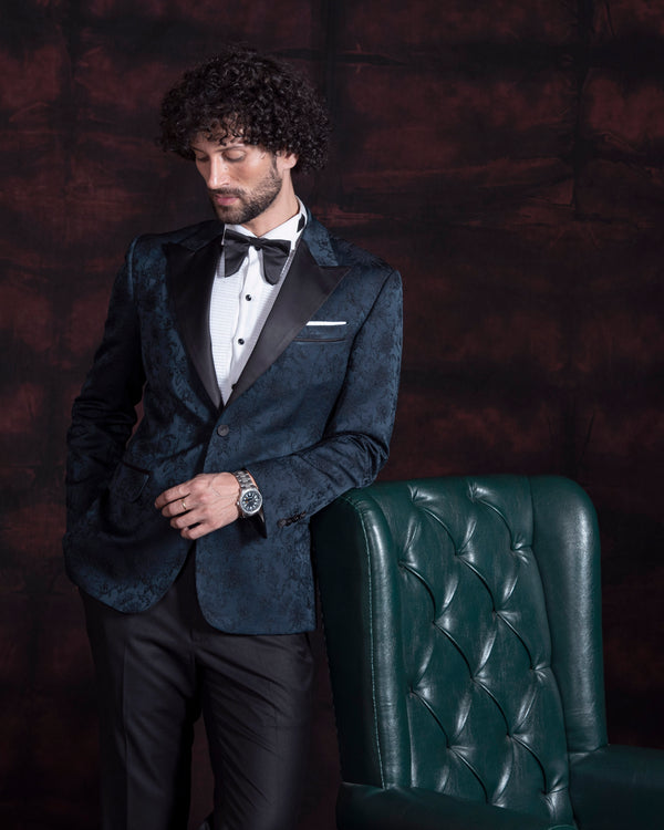 Green jacquard tuxedo jacket with peak lapel.  Paired up with jet black pants.