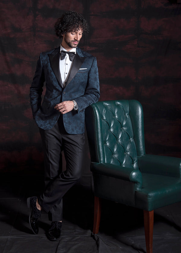 Green jacquard tuxedo jacket with peak lapel.  Paired up with jet black pants.
