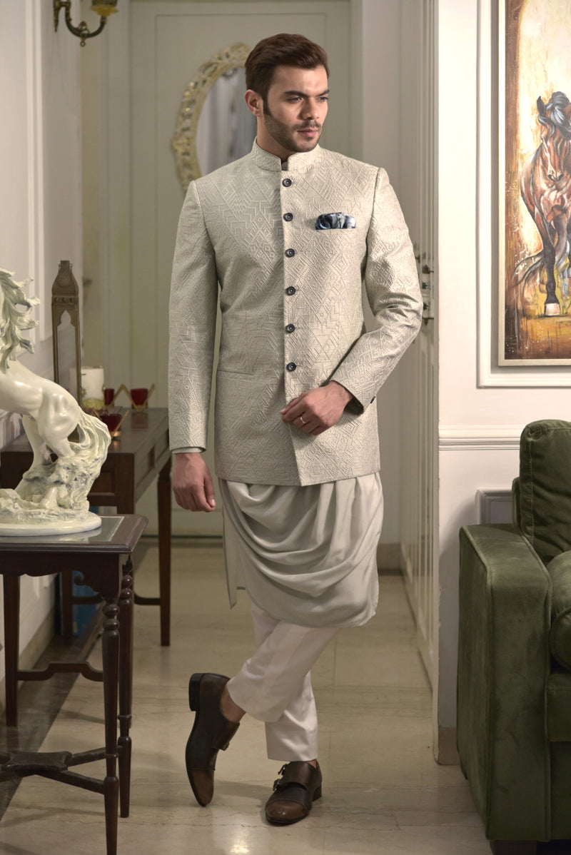 Pista green bandgala jacket with all over embroidery. Paired up with designer pista coloured drape kurta and off white pant cut pajama.
