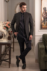 Black open bandgala jacket with pintuck all over and a touch of hand embroidery. Paired up with black long shirt and jet black pants.